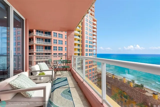 a kitchen with kitchen island a sink stainless steel appliances and a counter top space