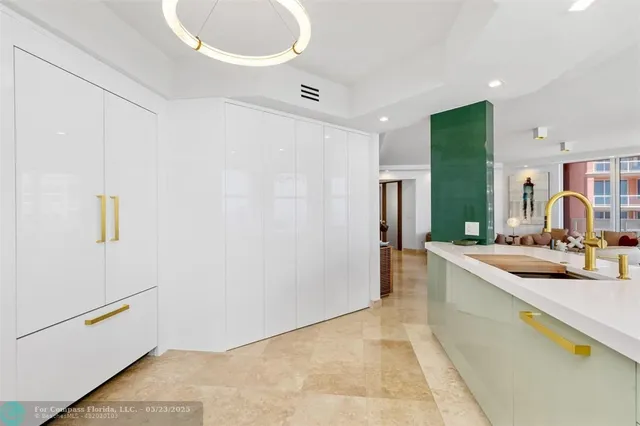 a bedroom with a bed couch and a large window