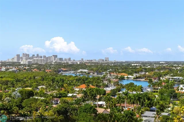 a bedroom with a bed and a potted plant