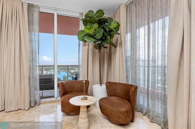 a view of kitchen with stainless steel appliances granite countertop sink and wooden floor