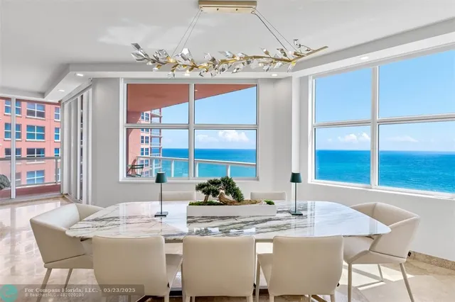 a kitchen with stainless steel appliances kitchen island granite countertop a sink and cabinets