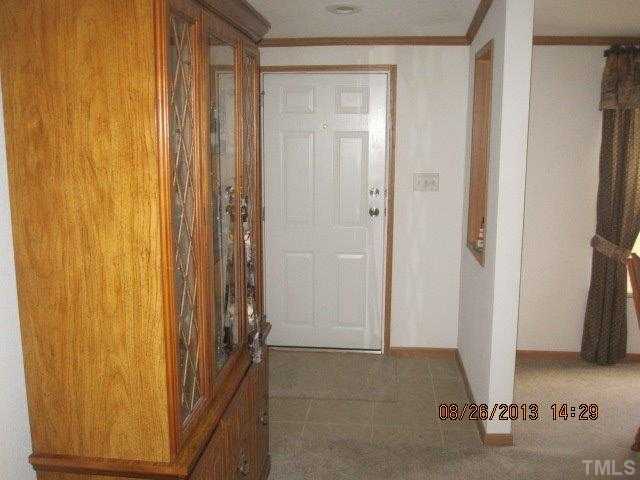 8603 South Creek Road Willow Spring, NC 27592 - Photo 5 of 7 a view of a room with a door