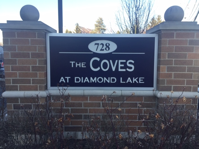 728 North Diamond Lake Road, Unit 211 Mundelein, IL 60060 - Photo 1 of 17 a close up of a street sign