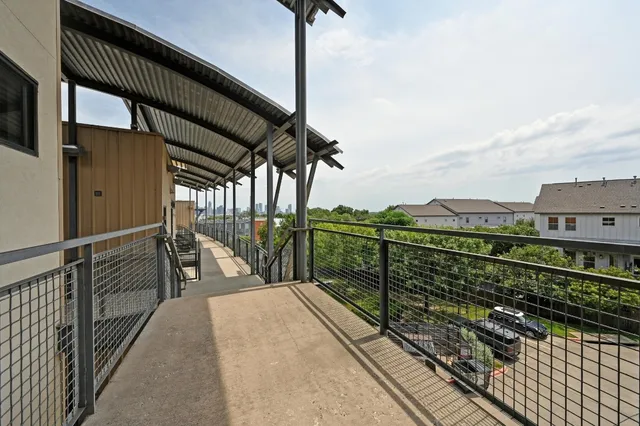 a view of a balcony with city view