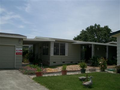 1945 Piner Road, Unit 100A Santa Rosa, CA 95403 - Photo 12 of 12 a front view of house with yard and outdoor seating