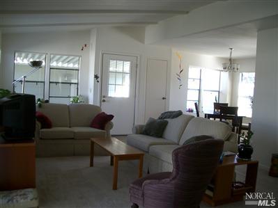 1945 Piner Road, Unit 100A Santa Rosa, CA 95403 - Photo 3 of 12 a living room with furniture and a window