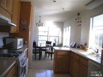 1945 Piner Road, Unit 100A Santa Rosa, CA 95403 - Photo 6 of 12 a view of a dining room with furniture and window