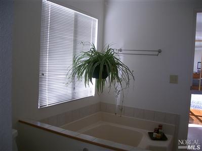 1945 Piner Road, Unit 100A Santa Rosa, CA 95403 - Photo 9 of 12 a bathroom with a shower and a window