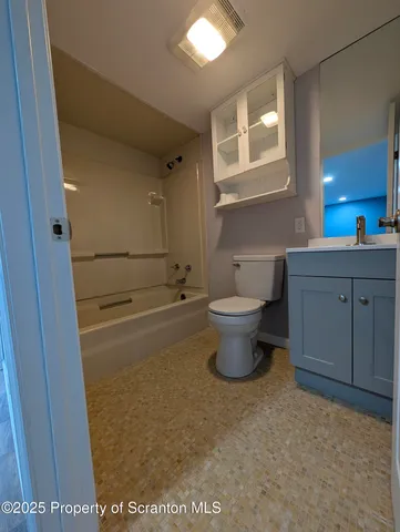 a view of bathroom with toilet sink and mirror