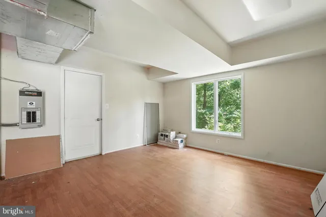 a view of a hallway with wooden shelves