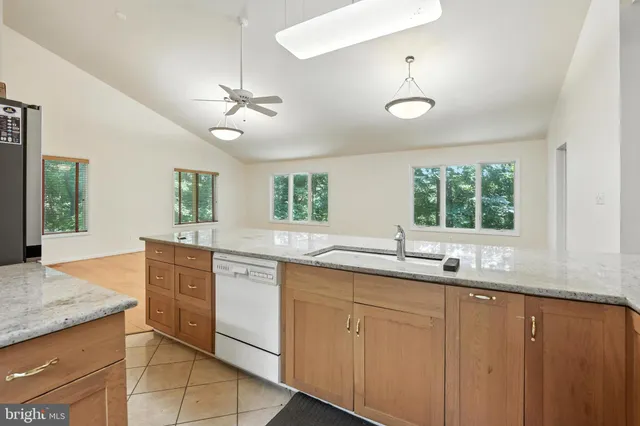 a kitchen with center island and windows