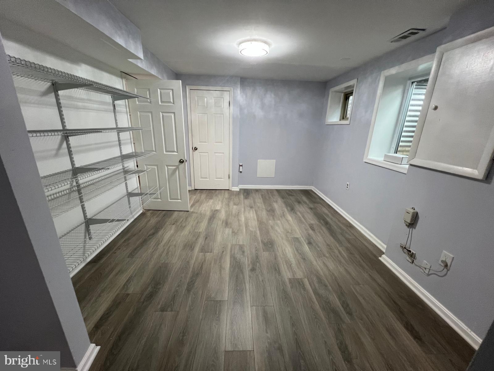 513 Creek Crossing Road Northeast Vienna, VA 22180 - Photo 12 of 15 wooden floor in an empty room with a window