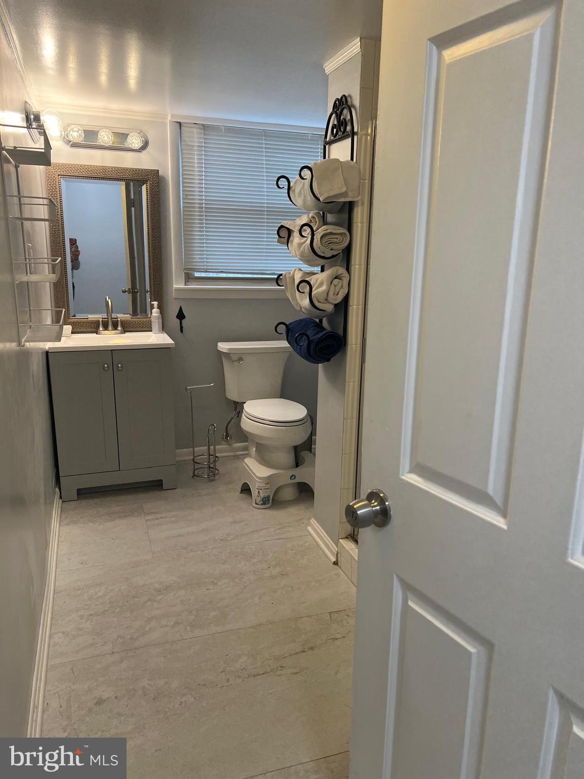 513 Creek Crossing Road Northeast Vienna, VA 22180 - Photo 13 of 15 a bathroom with a toilet sink and mirror