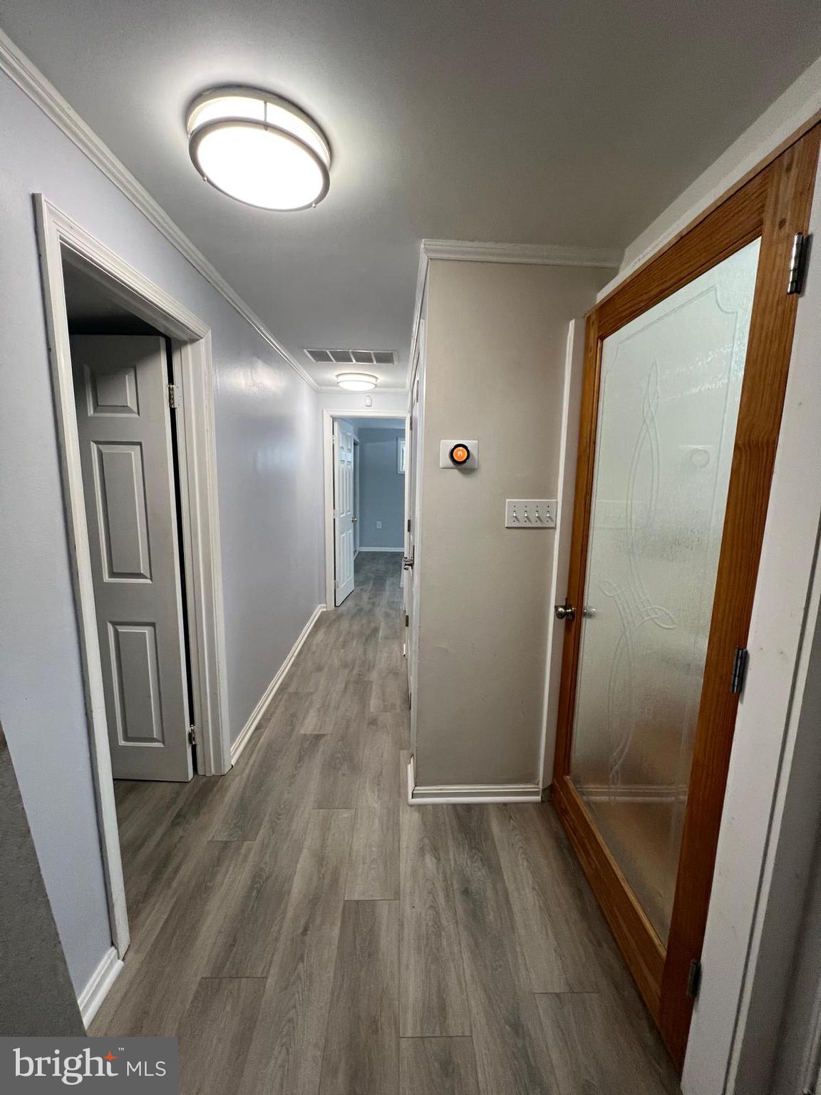 513 Creek Crossing Road Northeast Vienna, VA 22180 - Photo 15 of 15 a view of a hallway with wooden floor