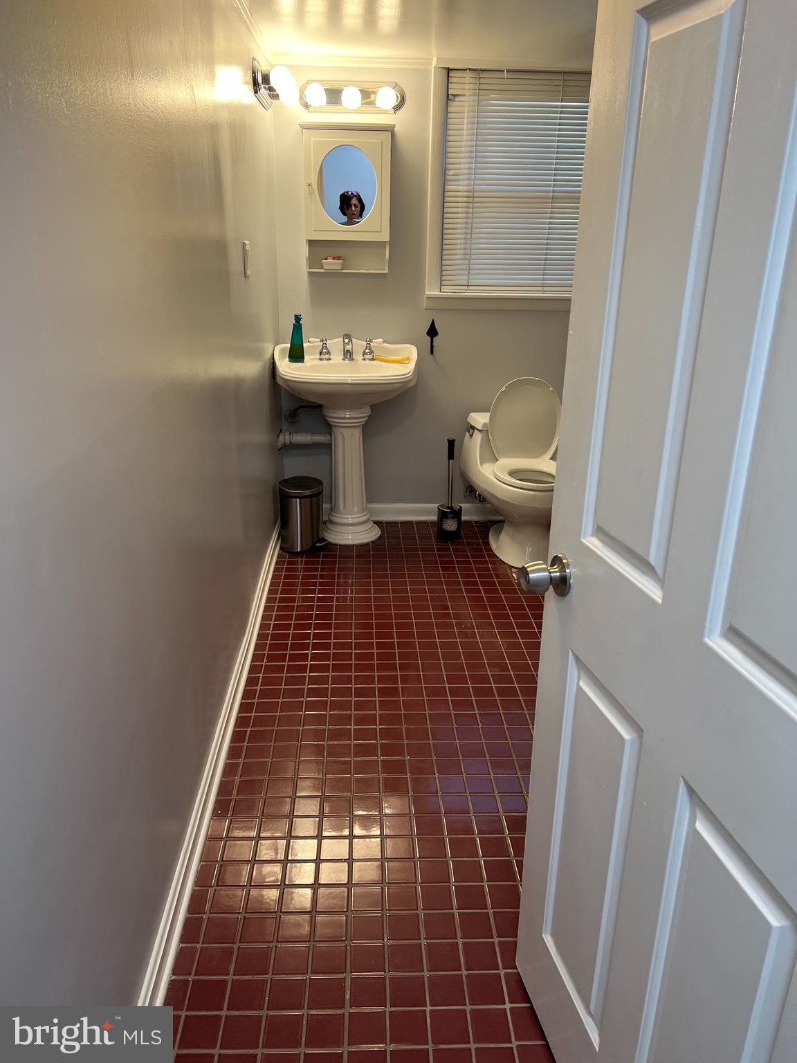 513 Creek Crossing Road Northeast Vienna, VA 22180 - Photo 4 of 15 a bathroom with a sink and toilet