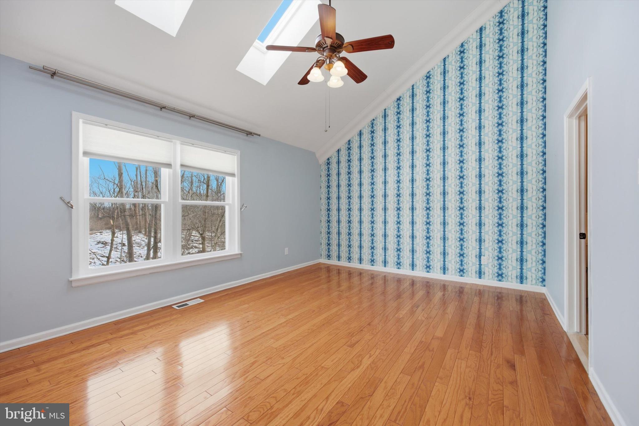 46 Main Street Chesterbrook, PA 19087 - Photo 30 of 44 a view of an empty room with a window and wooden floor