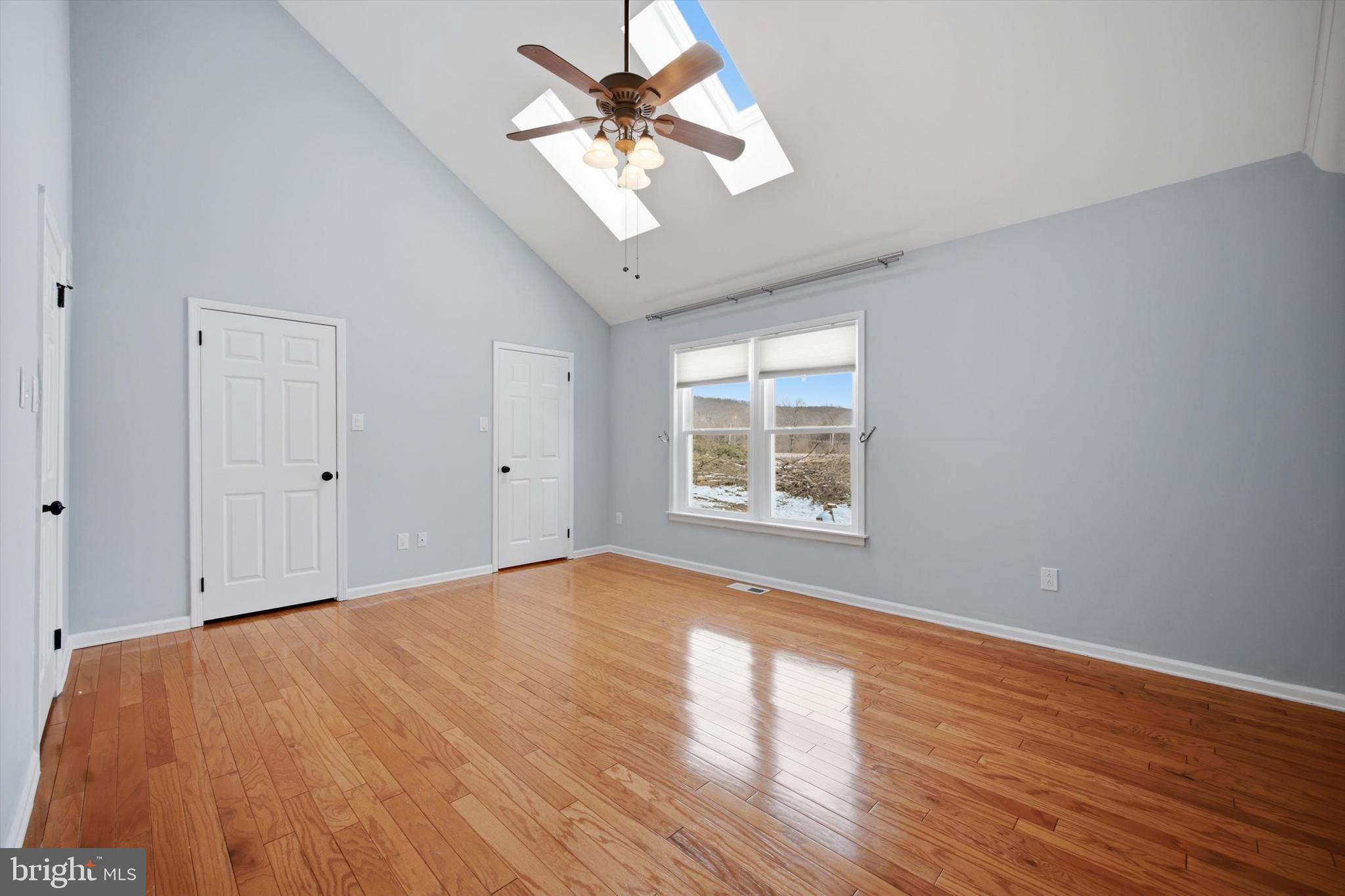 46 Main Street Chesterbrook, PA 19087 - Photo 31 of 44 a view of an empty room with a window and wooden floor