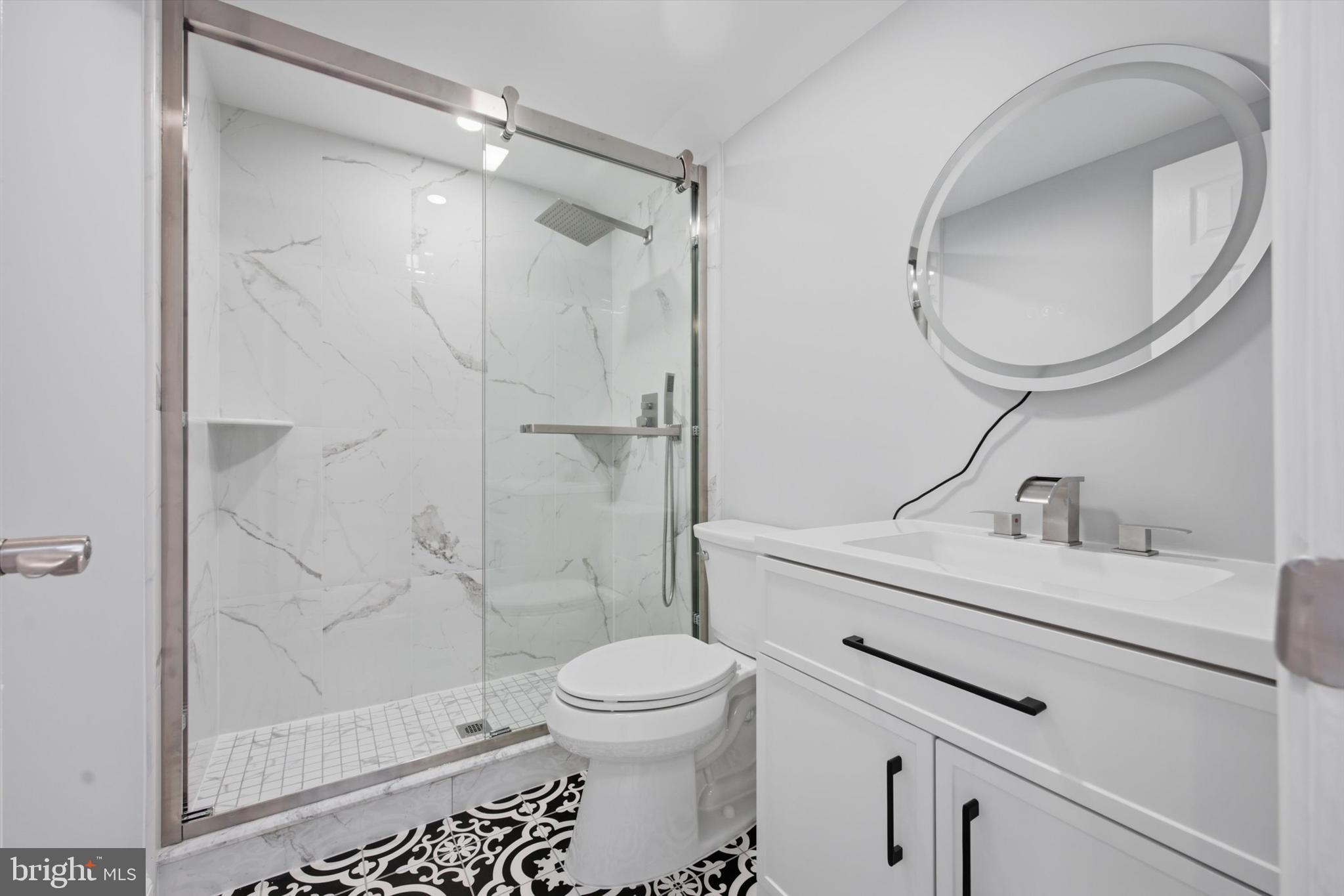 46 Main Street Chesterbrook, PA 19087 - Photo 35 of 44 a bathroom with a sink toilet and shower