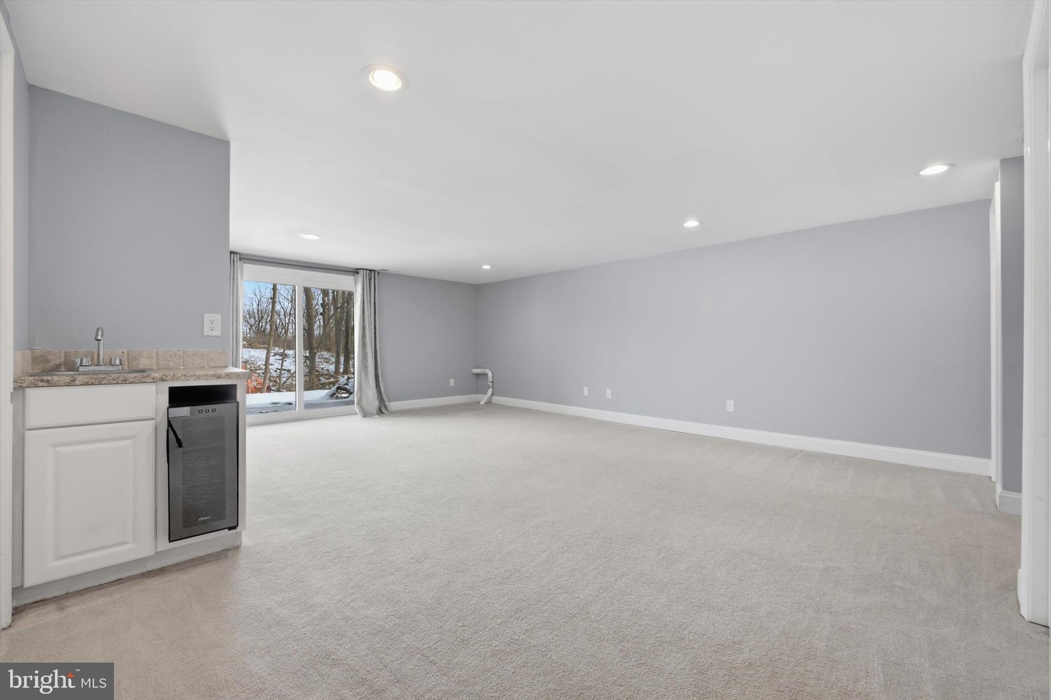 46 Main Street Chesterbrook, PA 19087 - Photo 36 of 44 a view of an empty room with kitchen and a window