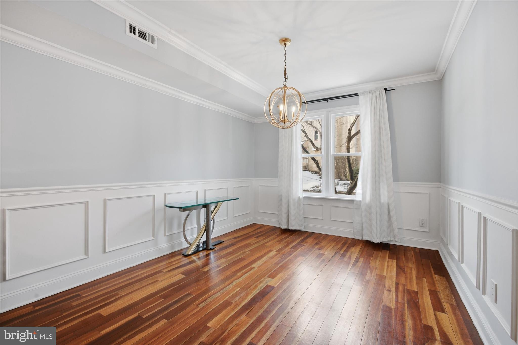 46 Main Street Chesterbrook, PA 19087 - Photo 6 of 44 a view of an empty room with wooden floor fridge and a window