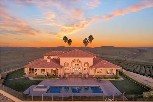 a front view of a house with swimming pool