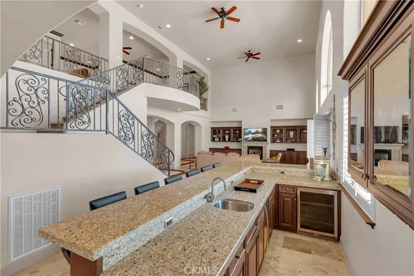 a large kitchen with stainless steel appliances granite countertop a large counter top and a stove