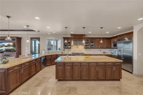 a kitchen with a table and chairs in it