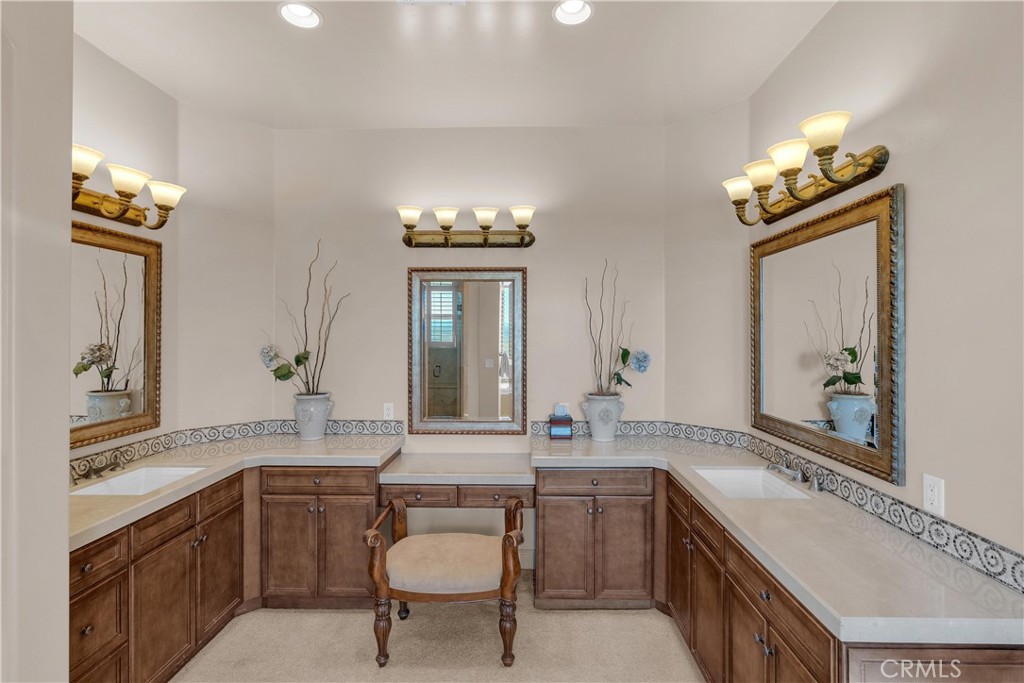 1990 East 46th Shandon, CA 93461 - Photo 25 of 70 a bathroom with a granite countertop sink a toilet a mirror and shower
