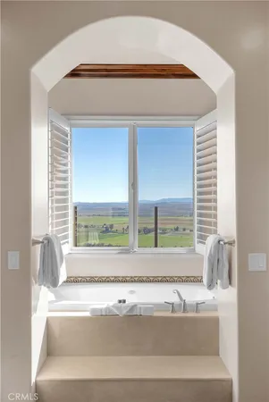 a front view of a house with large windows