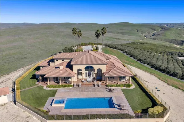 an aerial view of a house with a garden