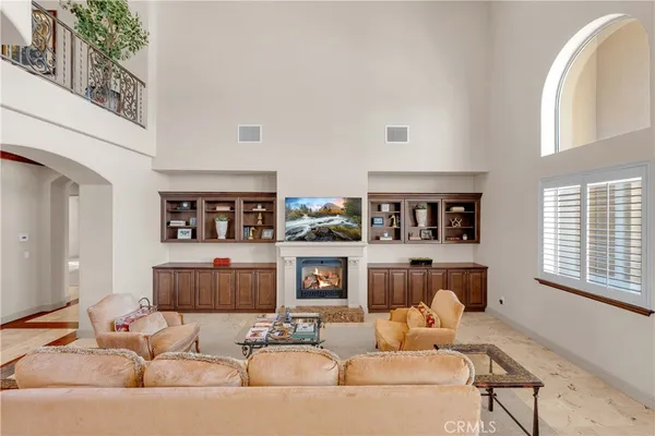 a large kitchen with kitchen island a large counter top space a sink stainless steel appliances and cabinets