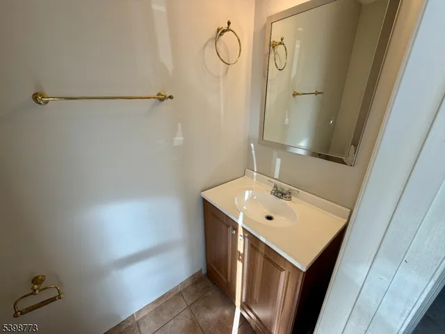 a bathroom with a sink a mirror and shower