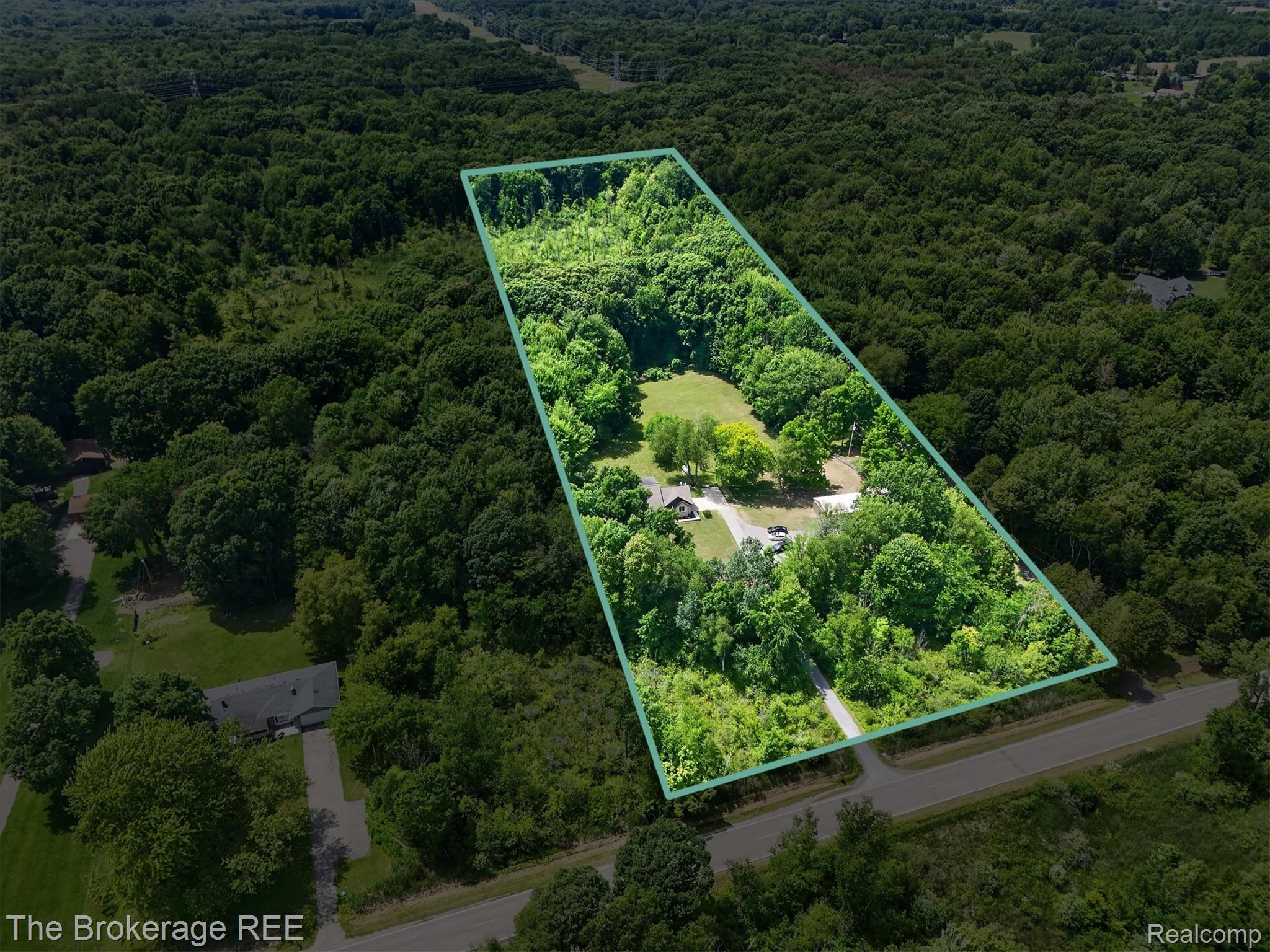 13269 North Genesee Road Clio, MI 48420 - Photo 8 of 67 Expansive wooded acreage featuring a cleared building site, established driveways, and a private setting