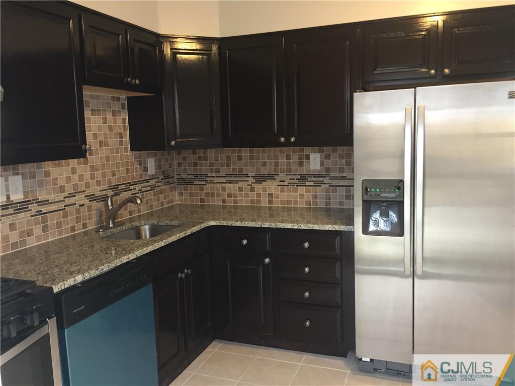 40 Parkerson Road Edison, NJ 08817 - Photo 4 of 11 a kitchen with a sink and cabinets