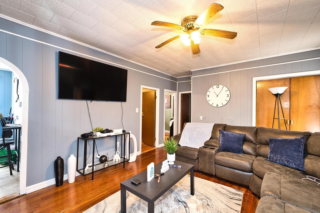 232 Alden Street Fall River, MA 02723 - Photo 8 of 34 a living room with furniture and a flat screen tv