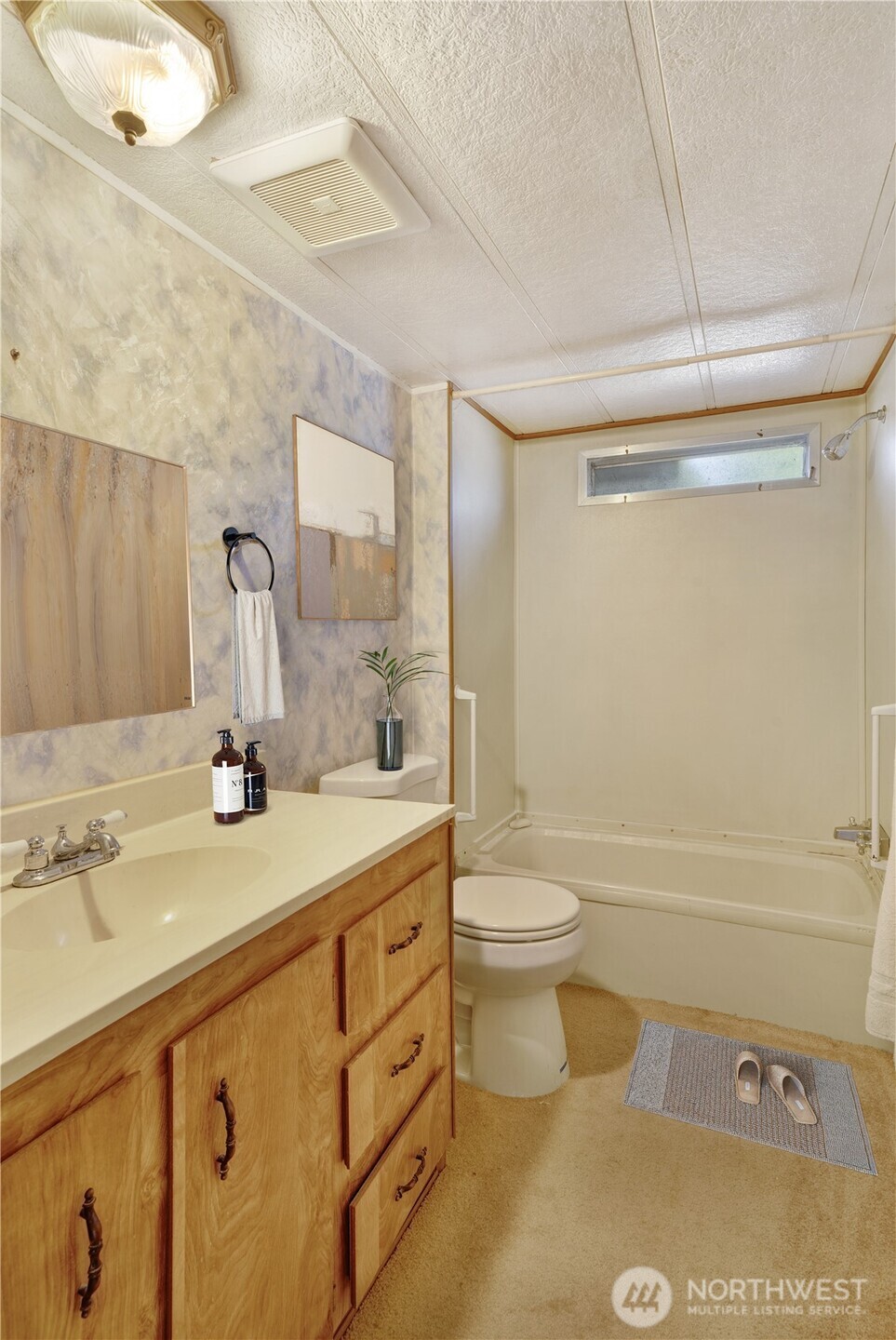 4806 Cushman Road Northeast, Unit 139 Olympia, WA 98506 - Photo 17 of 22 a bathroom with a sink a toilet and shower