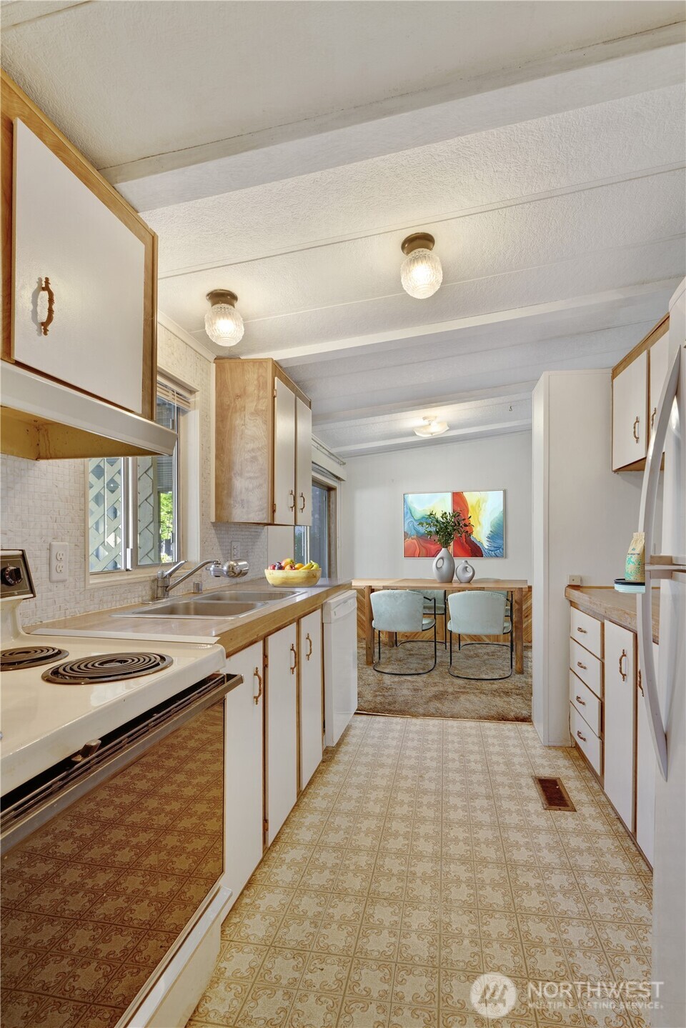 4806 Cushman Road Northeast, Unit 139 Olympia, WA 98506 - Photo 10 of 22 a kitchen with a sink appliances and cabinets