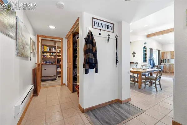 a view of a hallway with seating area
