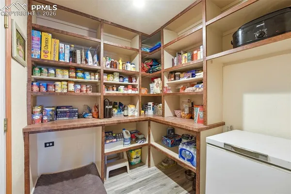 a room with a book shelf and a shelf