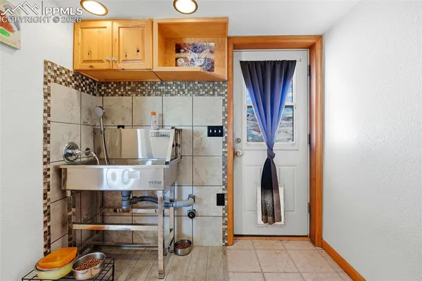 a bathroom with mirror and window