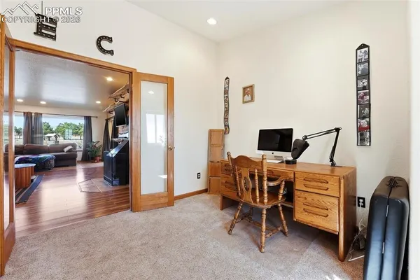 a view of a livingroom with furniture and a flat screen tv