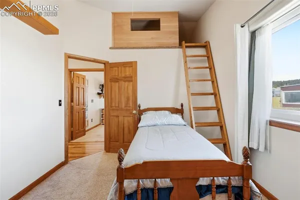 a view of an entryway with wooden floor and door