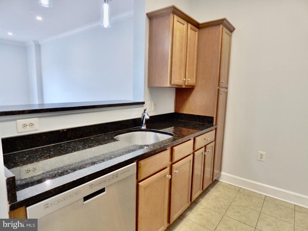 11800 Sunset Hills Road, Unit 118 Reston, VA 20190 - Photo 10 of 52 Sleek kitchen with modern finishes.