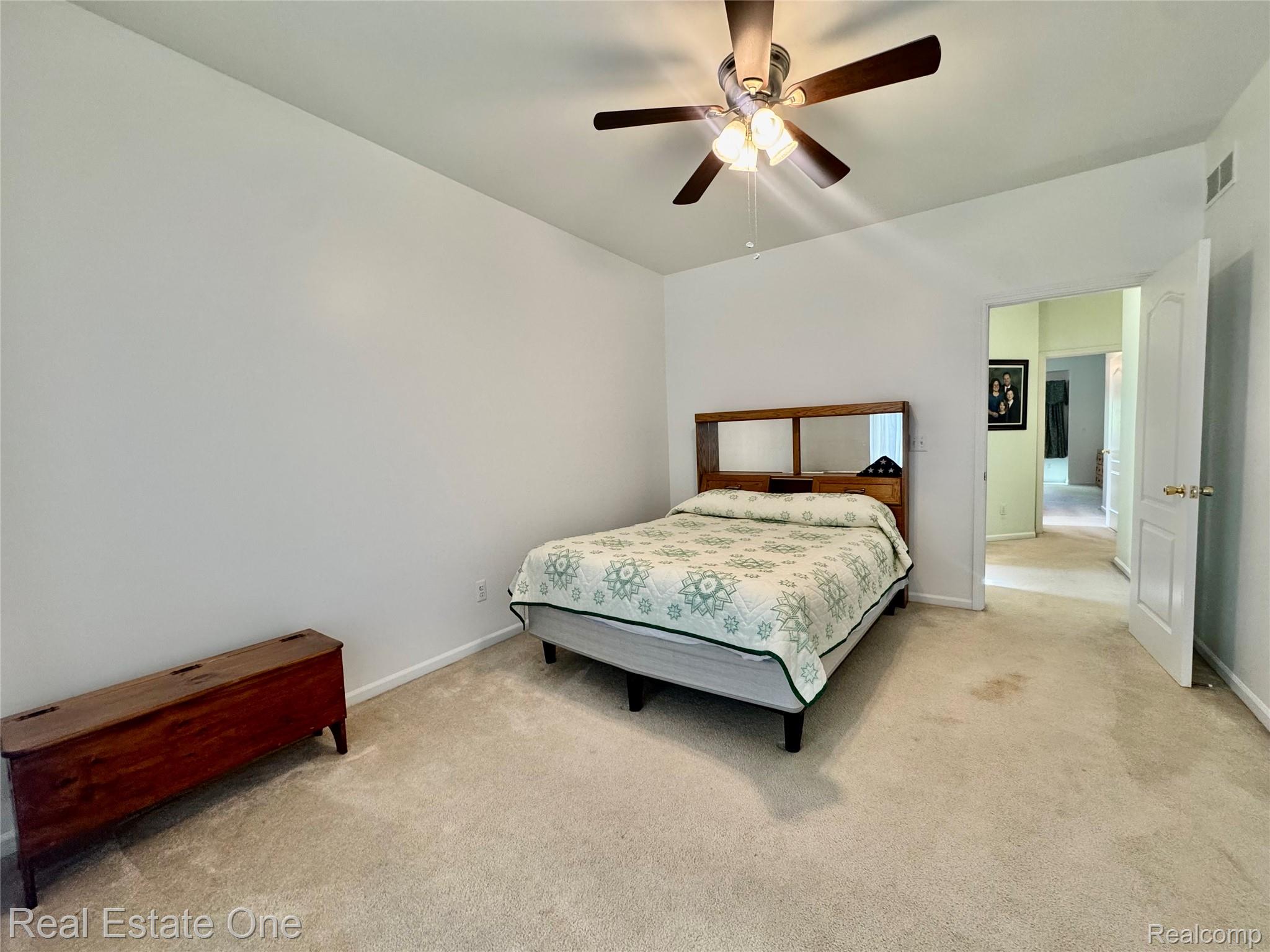 1668 South Shore Drive Rochester, MI 48307 - Photo 17 of 27 Bedroom with carpet flooring and a ceiling fan