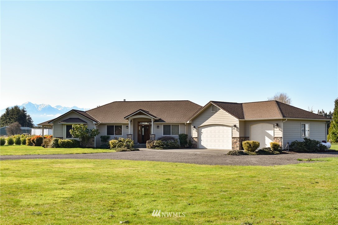 247 Jake Way Sequim, WA 98382 - Photo 1 of 40 a front view of a house with a yard