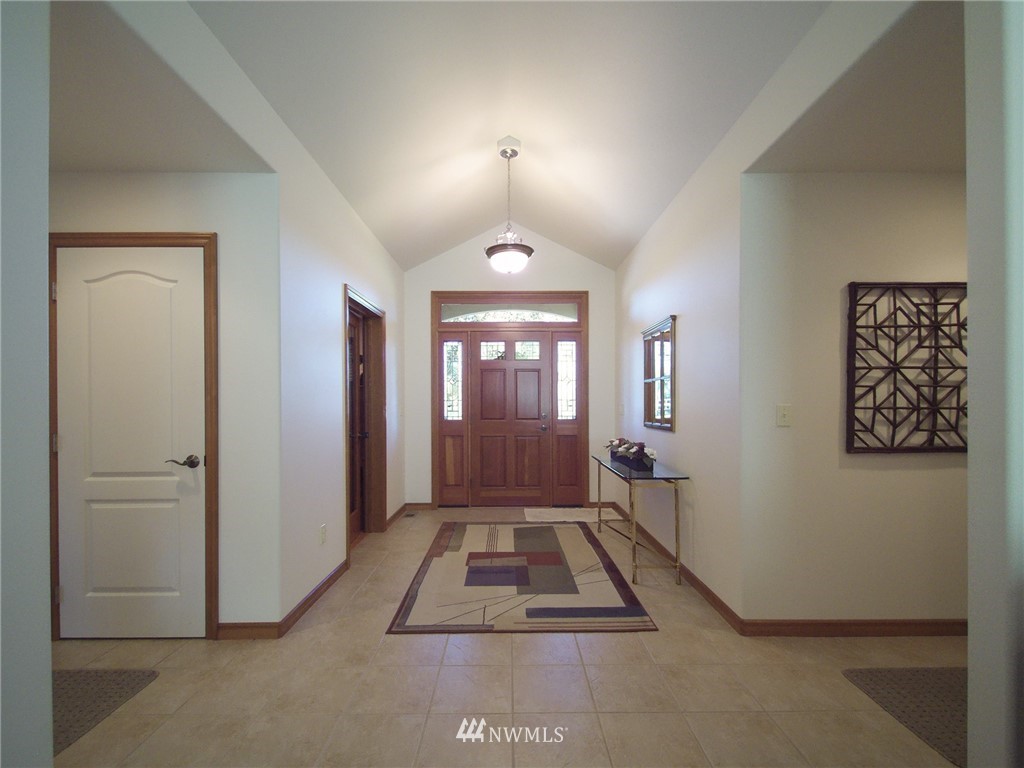 247 Jake Way Sequim, WA 98382 - Photo 2 of 40 an entryway door with wooden floor