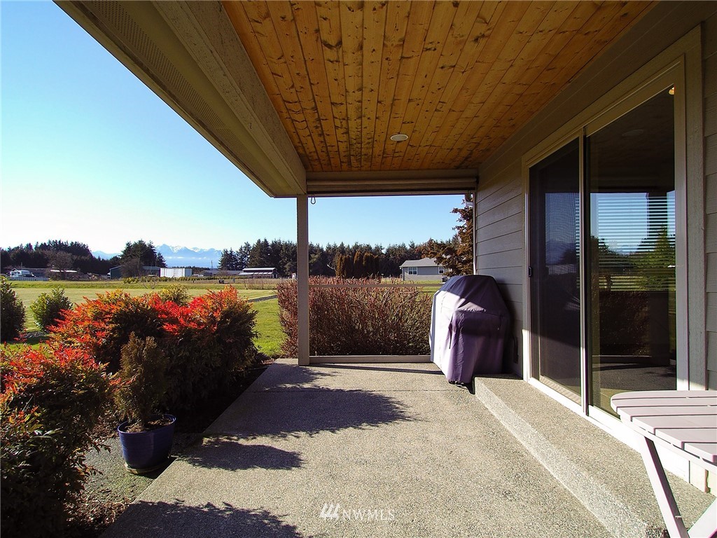 247 Jake Way Sequim, WA 98382 - Photo 11 of 40 a bedroom with a bed and a large window