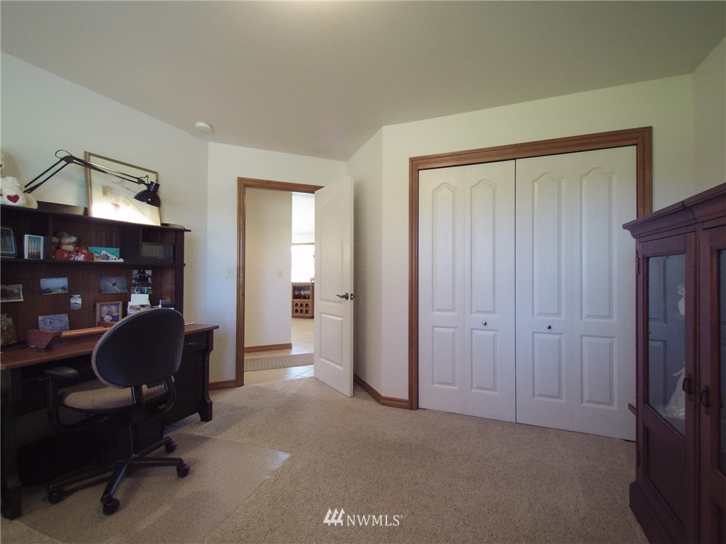 247 Jake Way Sequim, WA 98382 - Photo 14 of 40 a view of a workspace with furniture and a closet