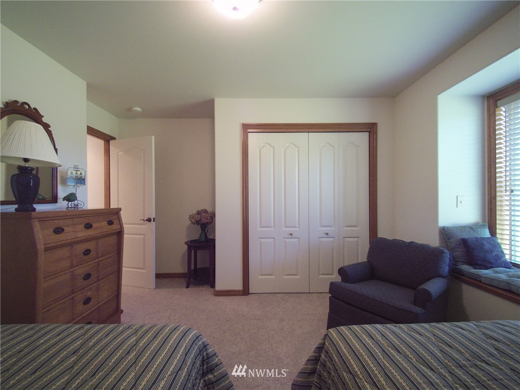 247 Jake Way Sequim, WA 98382 - Photo 20 of 40 a bedroom with a bed and furniture