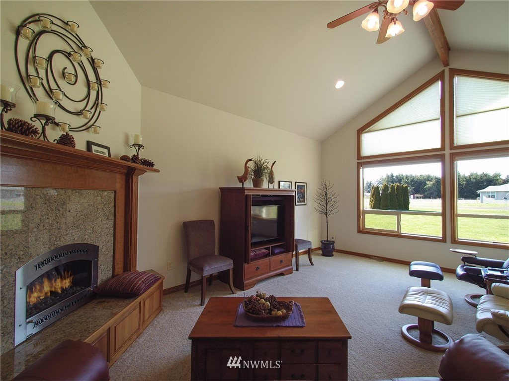 247 Jake Way Sequim, WA 98382 - Photo 3 of 40 a living room with furniture and a fireplace
